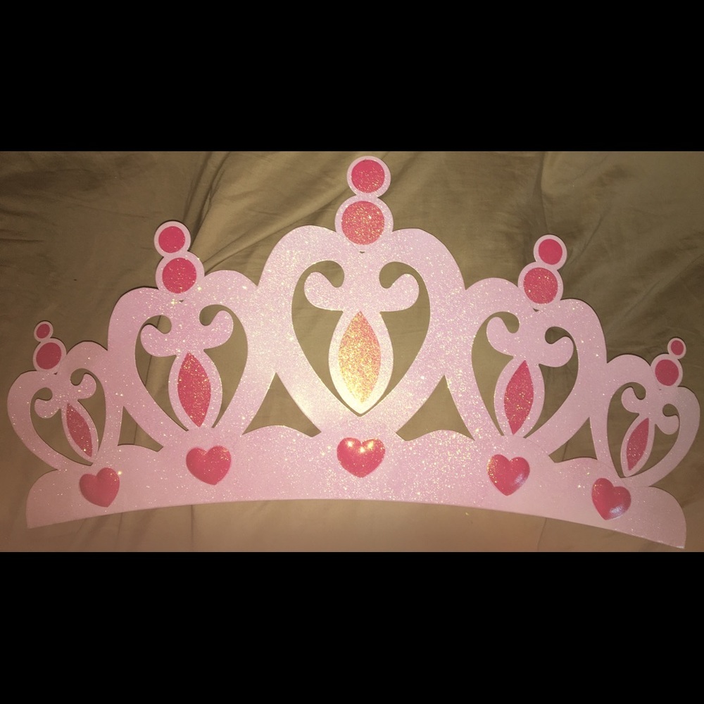 pink metal crown wall decor